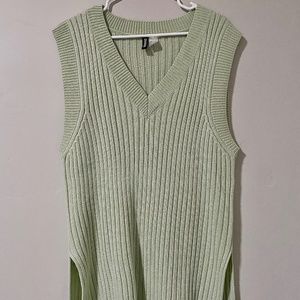 Long, oversized mint-colored sweater vest